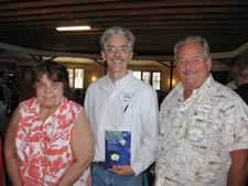 Speaker, John Bates, with meeting attendees at the Moen Lake Chain Association Annual Meeting at Pine Valley Lodge. - Click to enlarge.
